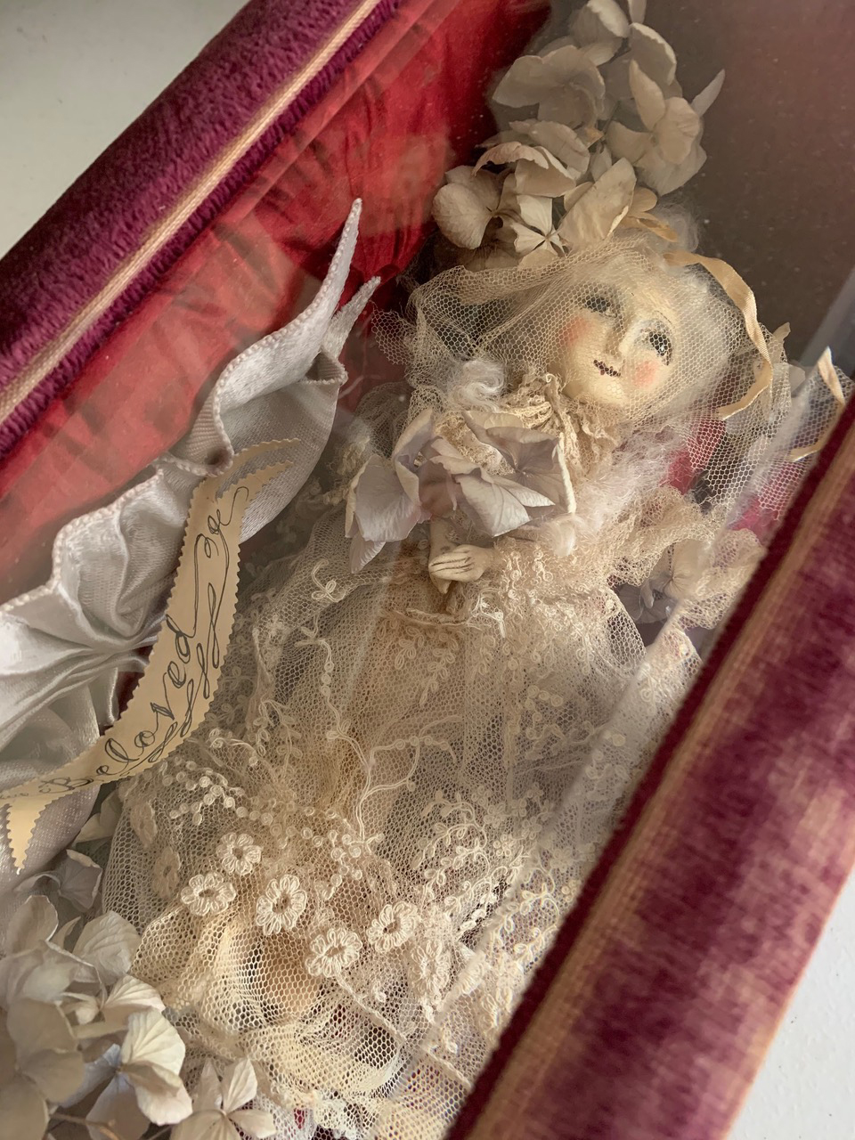 doll in coffin